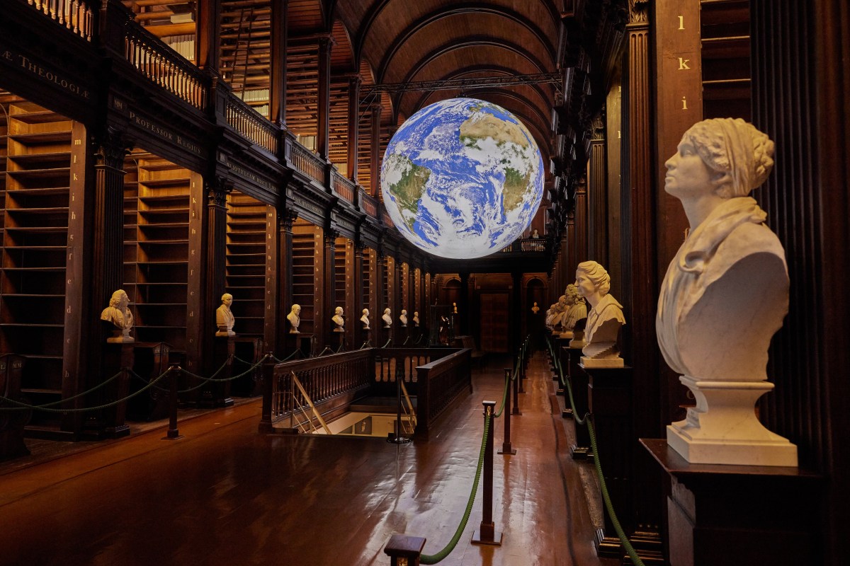 Image of Gaia in the Long Room with sculptures along the aisles
