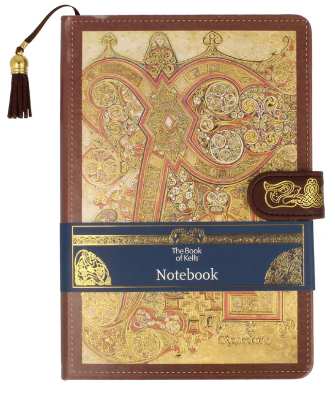Brown notebook with Celtic designs on the cover.